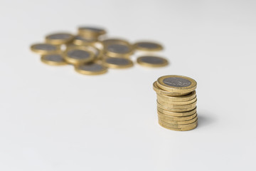 Euro coins pile and many more unordered on a white background