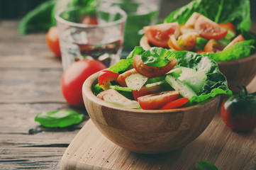Concept of healthy food: salad with tomato and cucumber