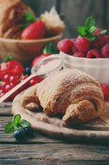 Fresh croissant with mix of berry