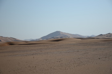 Fototapeta na wymiar Perspective view empty plane with stones sand dunes