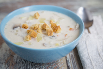 Creamy Mushroom Soup on a wooden background