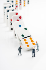 Domino effect concept of cascading errors or knock on effect of bad decisions © David Pimborough