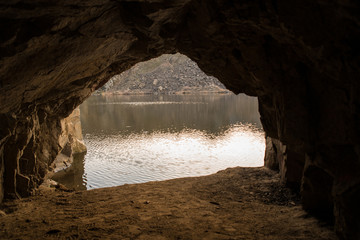 rock cave and lake