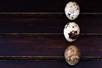 Quail eggs on wooden background 