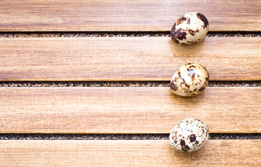 Quail eggs on wooden background 