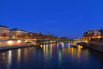 Fototapeta na wymiar Seine river at night in Paris, France.