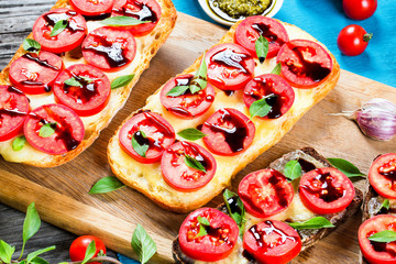 Caprese Garlic Bread ciabatta on a cutting board