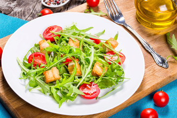 low-calories salad with chicken breast, arugula and tomatoes, cl