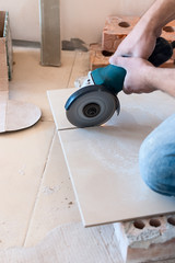 Worker using an angle grinder