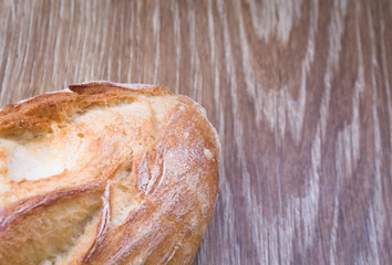 Bread on wooden background 