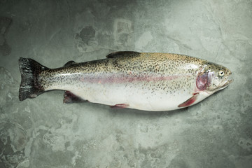 Whole fish on a mottled slate background