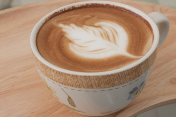 Closed up hot latte coffe ready for break time
