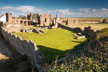 Ruins of Lindisfarne Priory on Holy Island on a sunny day