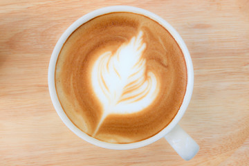 Closed up coffee and top up with foam