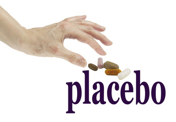 Is it real or a Placebo - Female hand reaching out to take a tablet from a group of different pills, which are positioned over the word PLACEBO, isolated on a white background