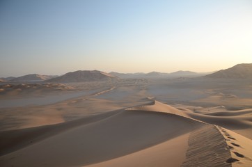 Fototapeta na wymiar Tracks in sand dune