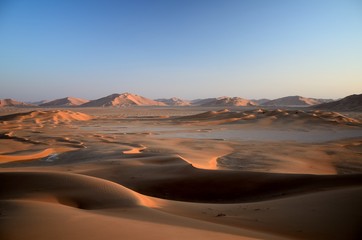 Fototapeta na wymiar Golden light and sand dunes