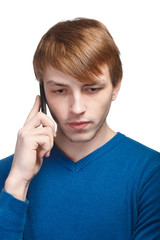 young man in blue pullover isolated on a white background talkin