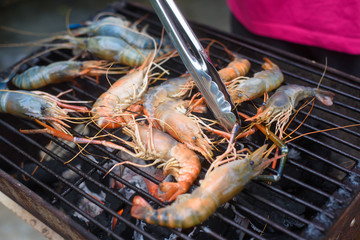 Grilled shrimps on the flaming grill.