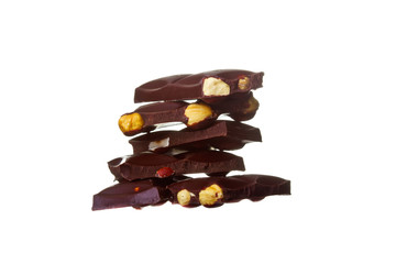 Chocolate pieces with nuts, isolated on white background