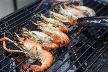 Grilled shrimps on the flaming grill.