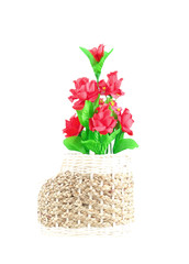 The artificial flower in the pot on white background