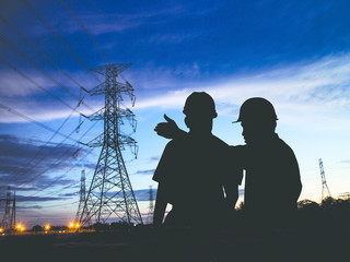 Fototapeta na wymiar silhouette man survey and civil engineer stand on ground working