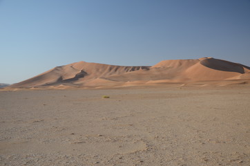 Fototapeta na wymiar Plane and sand dunes Oman