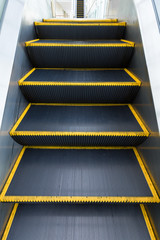 Moving escalator before the next floor