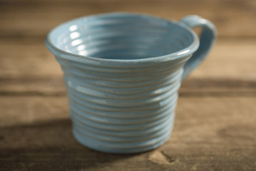 Close Up of Blue Teacup on a Wooden Surface