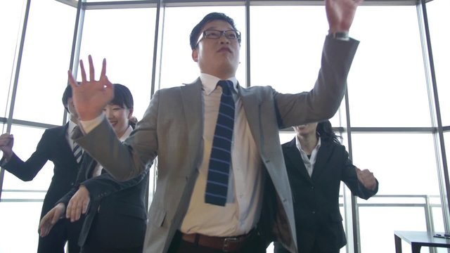 A Japanese Boss and his team let loose and dance at the office SLOWMO