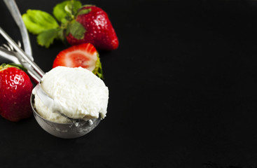 Vanilla ice cream scoop and  strawberry
