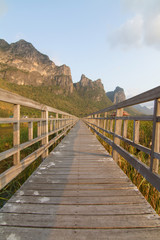 wood walkway around the mountain park in evening