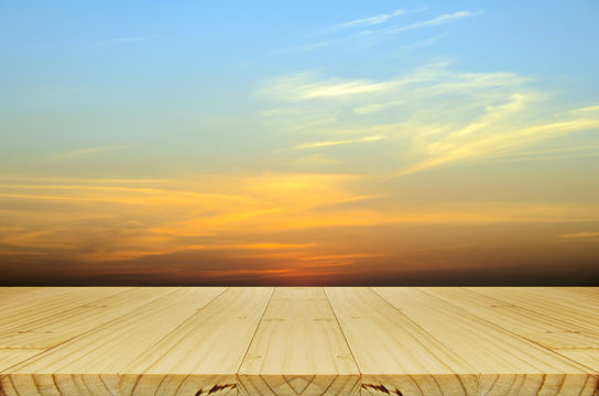 Picnic Wood Table And Blurred Sunrise Background.