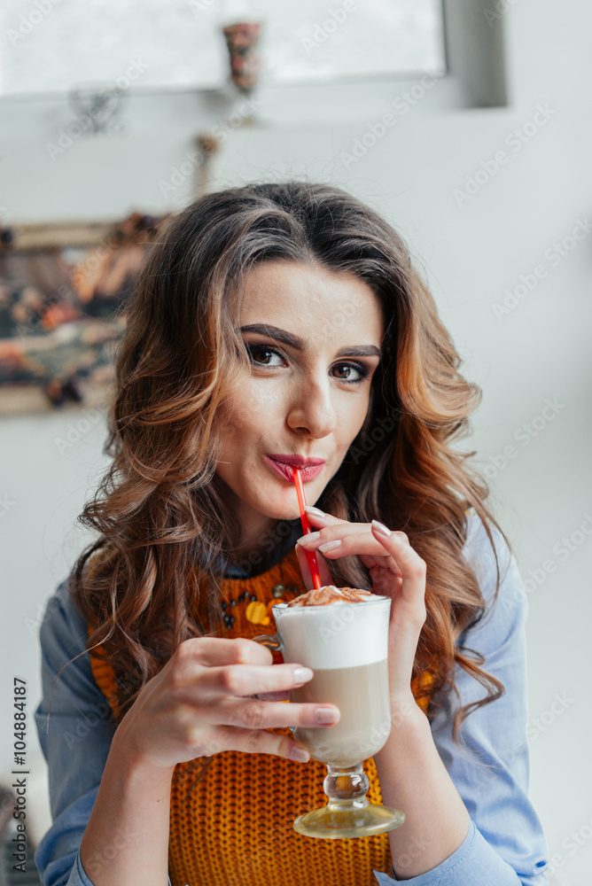 Wall mural business lady in cafe drinking latte