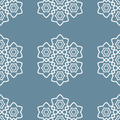 Seamless islamic background. White geometric flowers on blue background