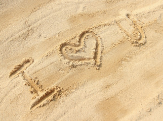 Fototapeta na wymiar I love you - sand writing on the beach