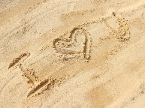 I love you - sand writing on the beach