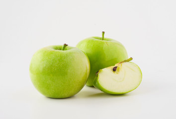 ripe green apples and apple slice on white background
