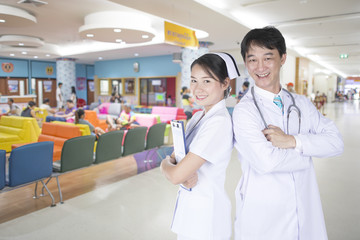 Doctor and nurse with a commitment in the hospital.