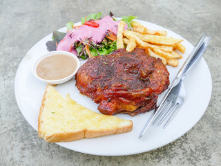 Chicken steak with salad and fried potato