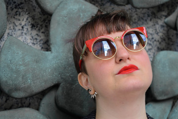 Head-shot Young White Female Wearing Sunglasses, Facing Towards Camera, Monochrome Background