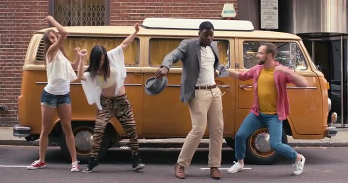 Group of multi-racial dancers street dancing funky freestyle in the city