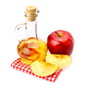 apple cider vinegar and apples isolated on white background