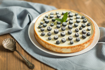 blueberry cheesecake on wooden table