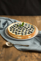 blueberry cheesecake on wooden table