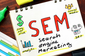 SEM written in a notebook. Business concept.