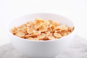 granola in white bowl on white background