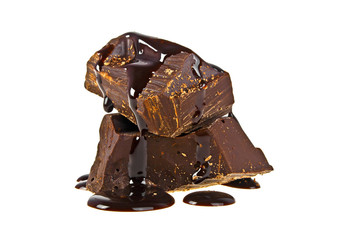 Slices dark chocolate bar poured chocolate isolated on white bac