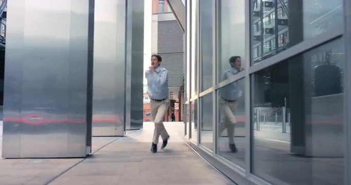 Contemporary funky caucasian businessman street dancer dancing freestyle in the city